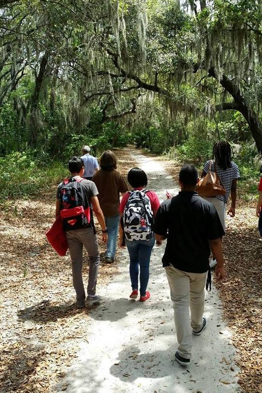 Students walking a trail on the Valencia campus.